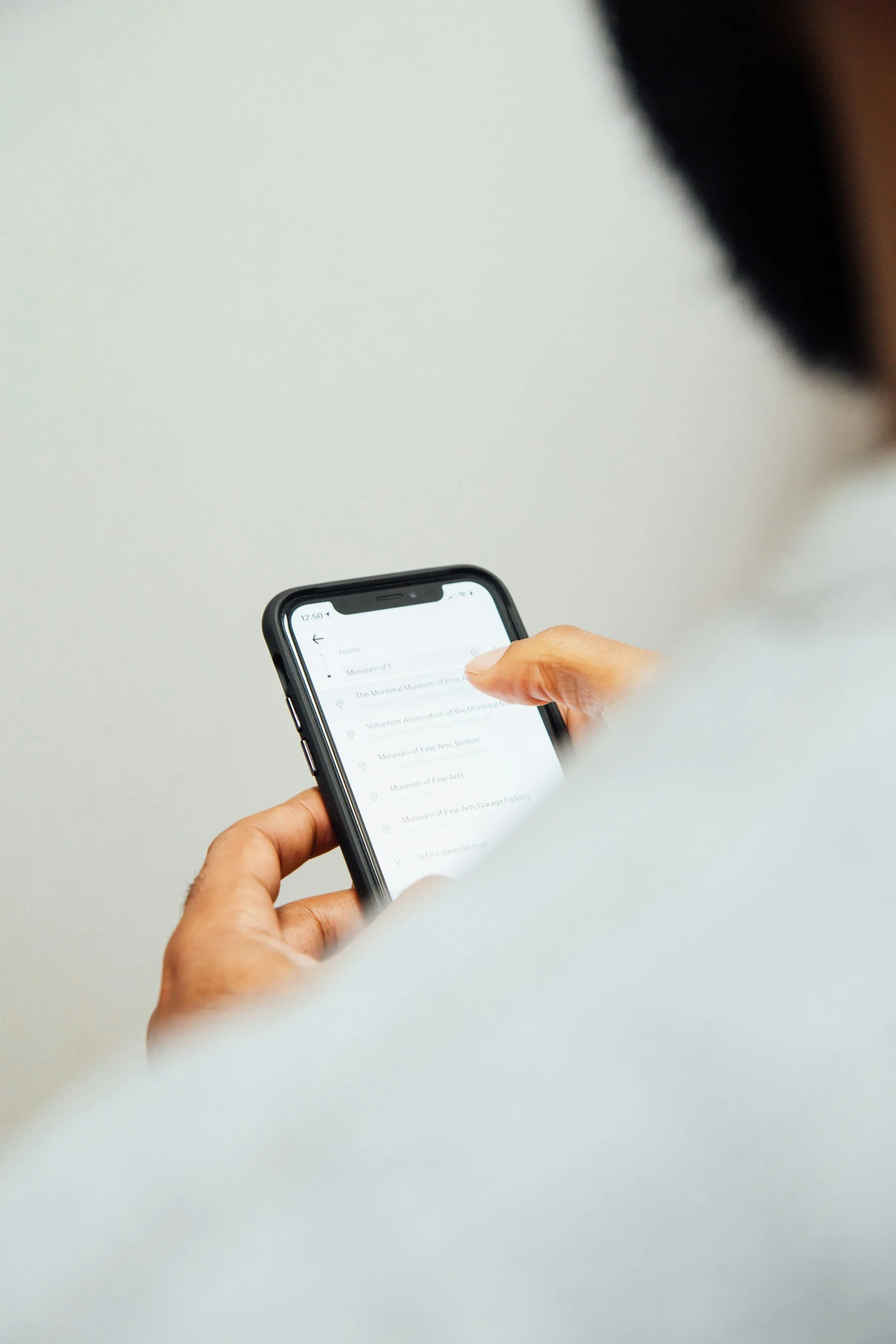 Person typing messages on a phone