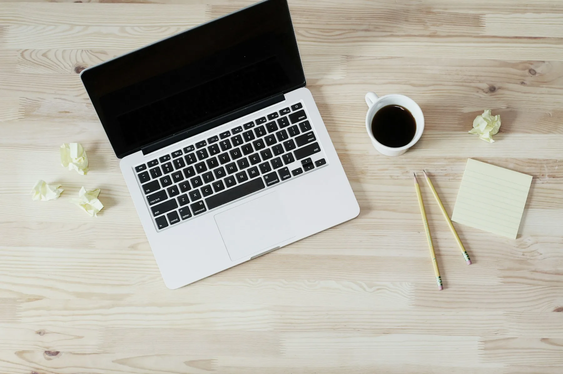 Minimal desk with laptop and notebook